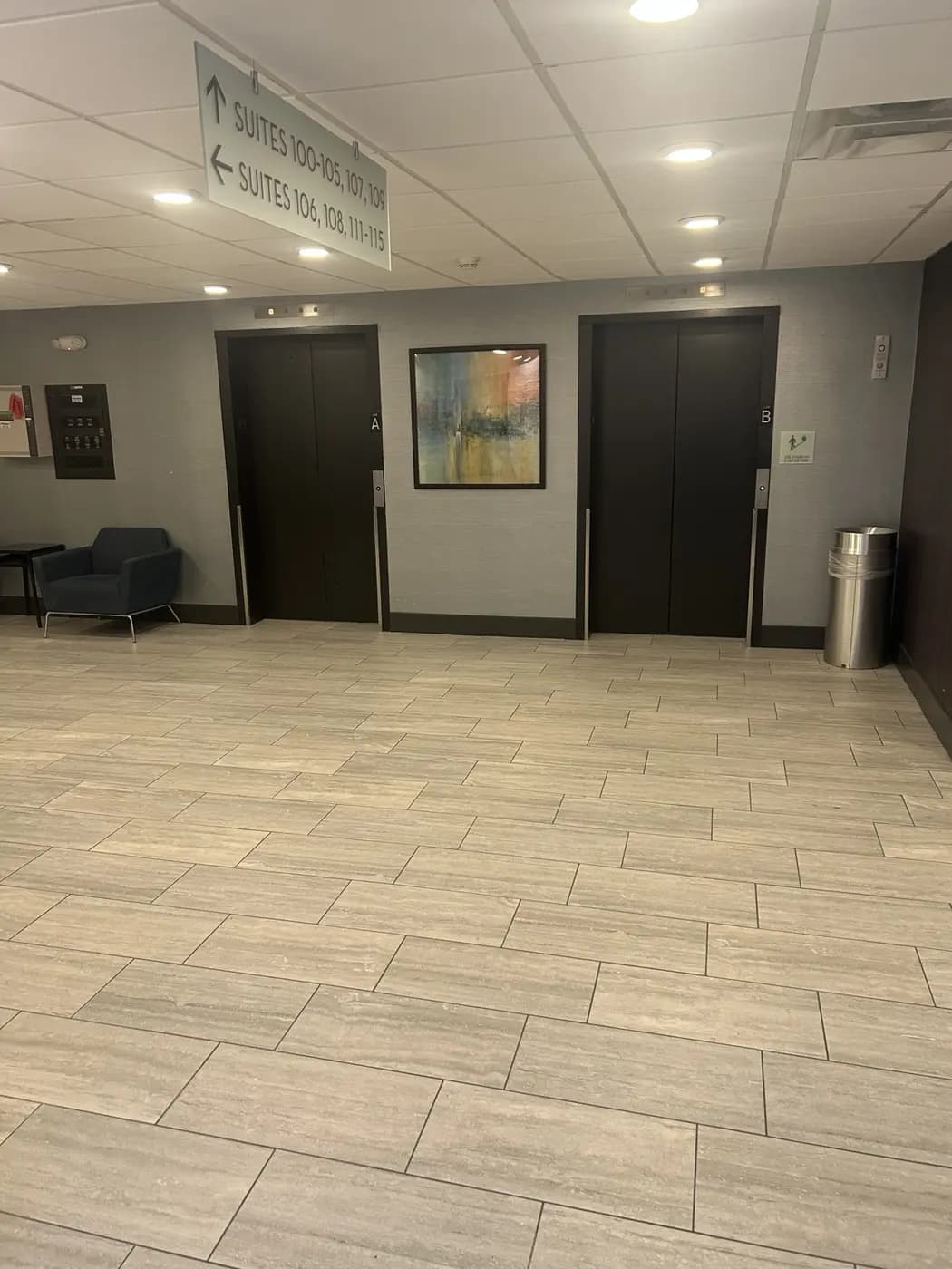 Commercial elevator lobby with large-format tile flooring