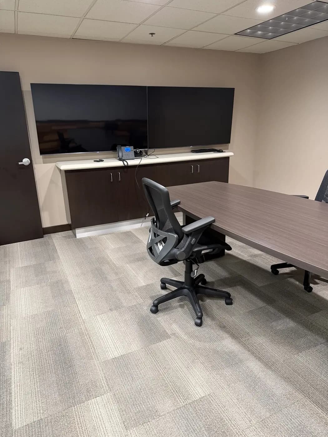 Commercial conference room with modular carpet flooring